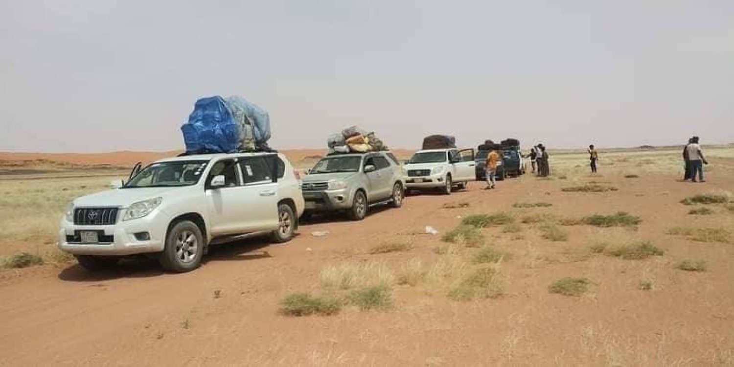 Travelers on the Al-Jawf desert road