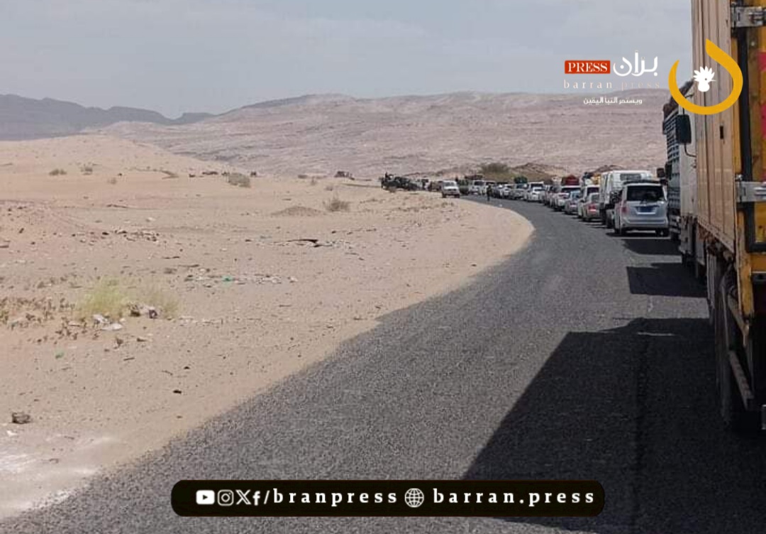 Passenger vehicles pass through the Marib-Al Bayda road