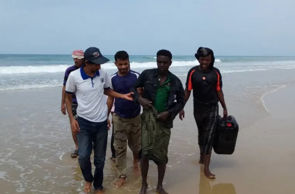 Migrants receive assistance after their boat capsized off the coast of Yemen (AFP)