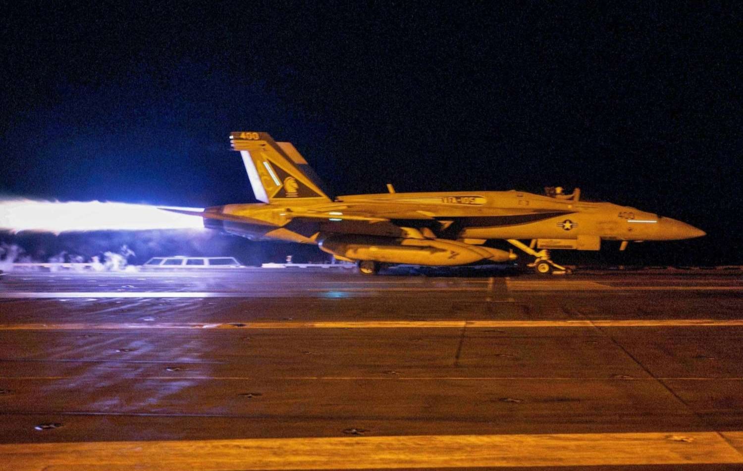 US fighter jet takes off from a barge in the Red Sea